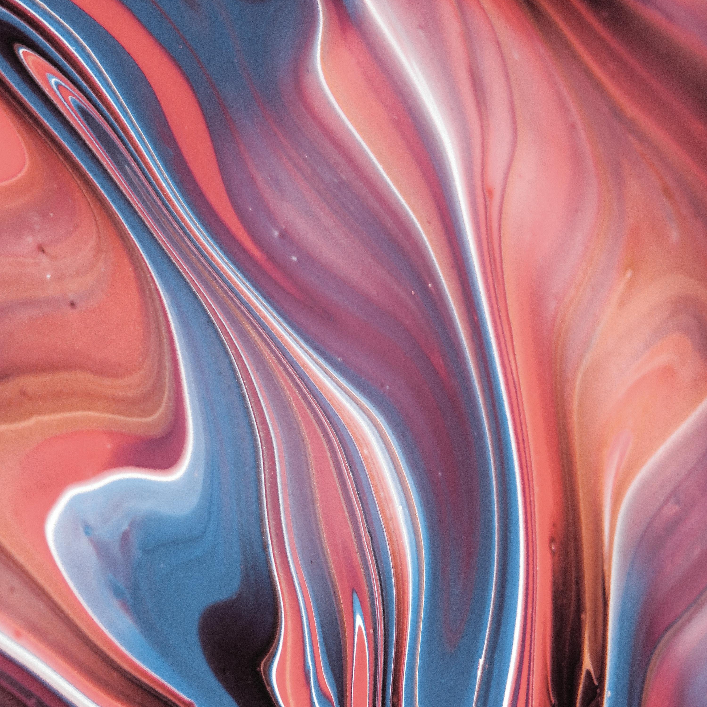 Psychedelic visuals with shades of blue and red.